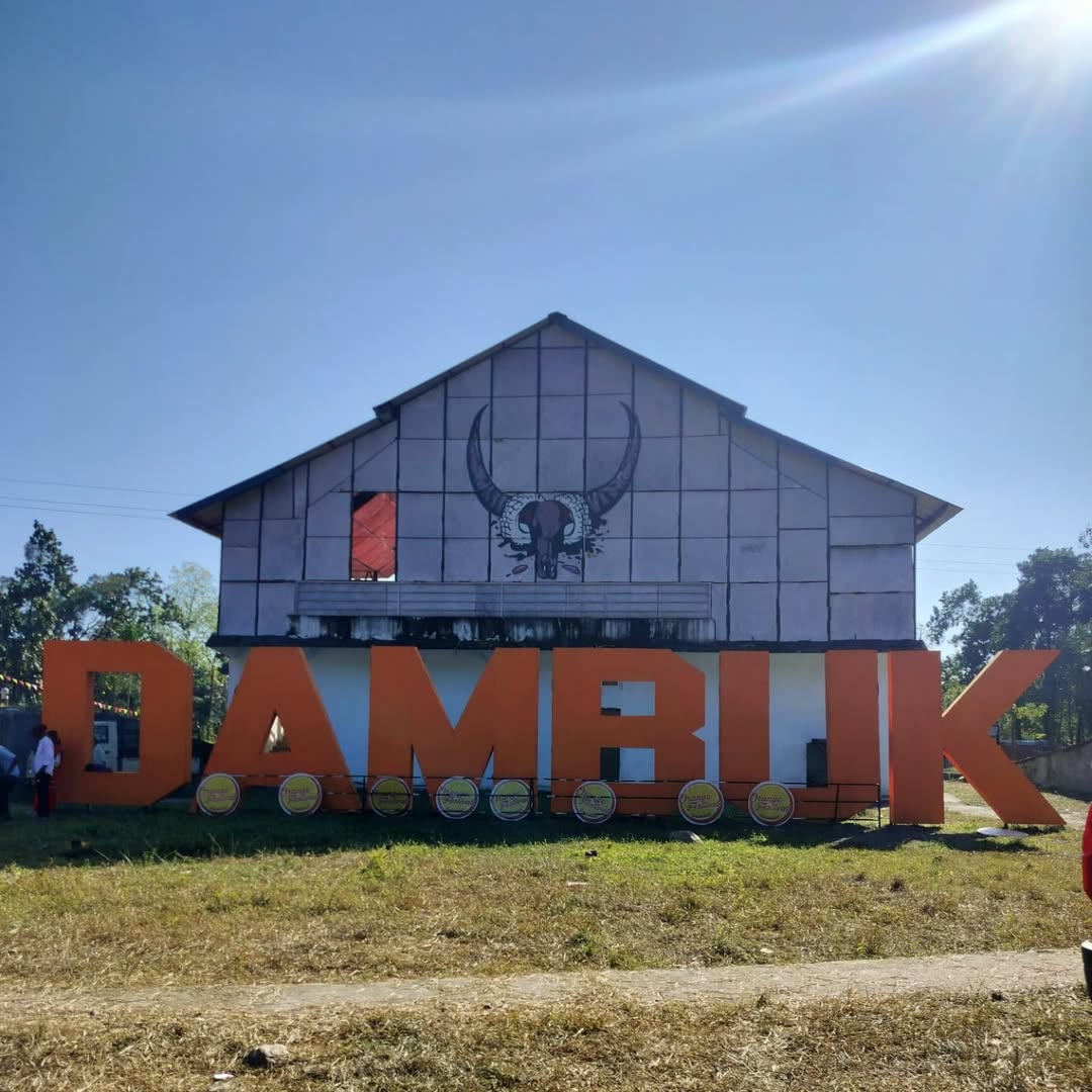 A vibrant scene from the Orange Festival Dambuk 2025, featuring live music performances in the stunning Arunachal Pradesh landscape